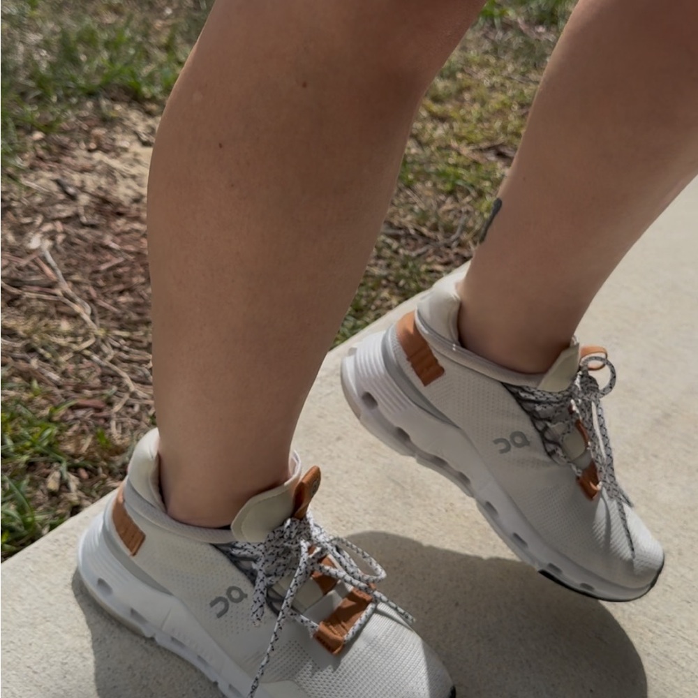 On Running White Sneakers with Brown Accents